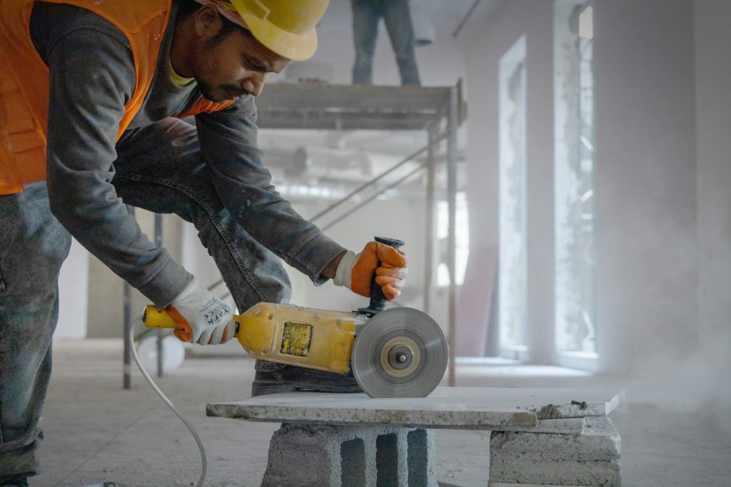 Worker installing a window frame in natural light