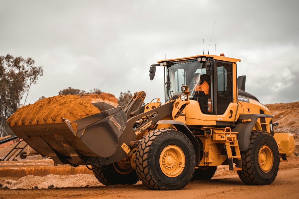 Yellow front-end wheel loader at a construction site