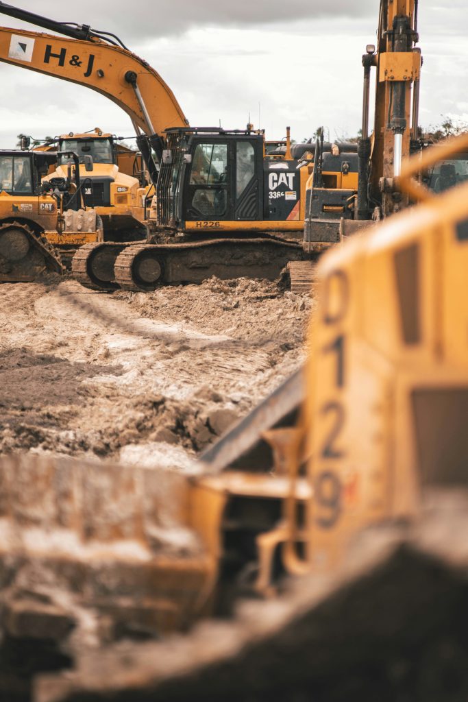 Excavator working on a dirt construction site